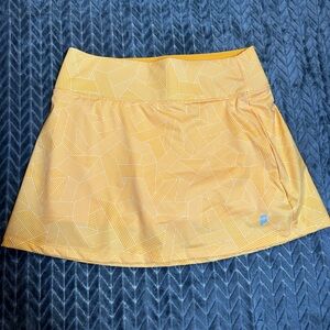 NWOT PRINCE Orange and white patterned women’s tennis skirt
